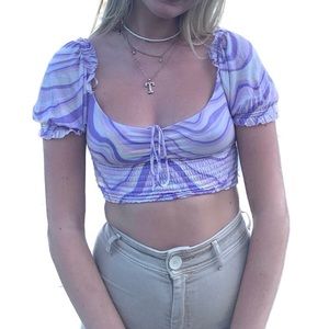 Abstract marble swirl pattern top with puff sleves and tie front.